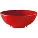 A red bowl with three legs.