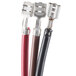 A close-up of three different colored cables with one red, black, and brown cable.