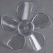 A close-up of a plastic fan blade with a flower-shaped design.
