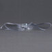 A clear plastic propeller on a table.