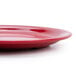 A close-up of a red GET Red Sensation narrow rim plate.