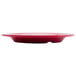 A red GET Red Sensation melamine plate with a wide rim.
