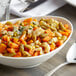 A bowl of mixed vegetables on a table.