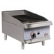 A Cooking Performance Group 15" natural gas countertop lava briquette charbroiler with a stainless steel grill and a pilot control panel.