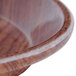 A round fiberglass tray with a country oak design and a brown rim.