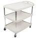 A gray Metro utility cart with three shelves and wheels.