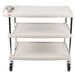 A gray Metro utility cart with three shelves and wheels.