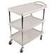 A gray Metro utility cart with three shelves and wheels.