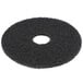 A black Scrubble by ACS 15" black stripping floor pad with a hole in the center.