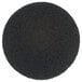 A black circle with small texture.