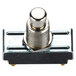 A close-up of a Nemco push button switch with a metal piece and silver knob.
