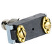A close-up of a black and gold Nemco push button switch.