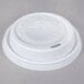 A white plastic lid for a Dart foam cup with a hole.
