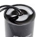 A black cylindrical Avantco capacitor with a wire attached.