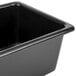 A black rectangular Metro utility bin on a counter.