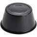 A black Solo polystyrene souffle cup with a lid on top.