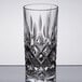 A close-up of a Nachtmann Noblesse Longdrink Collins glass with a diamond cut design.