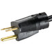 A close-up of a black power cord with a gold and black plug.