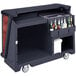 A black Cambro portable bar cart with bottles inside.