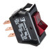 A close-up of a Nemco Rocker Switch with a red push button and black background.