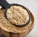 A white bowl filled with Maple Brown Sugar Oatmeal with a spoon.