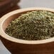 A bowl of Regal Delicious Stew Herb Blend sitting on a wooden table.