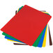 A stack of Tablecraft flexible cutting boards in different colors.