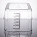 A Rubbermaid clear plastic food storage container with black lines and a white lid.