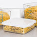 Rubbermaid clear plastic containers with pasta in them on a kitchen counter.