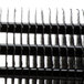 A close up of an Avantco evaporator coil with black stripes on metal.