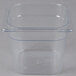 A Rubbermaid clear plastic food pan with a lid.