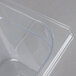 A clear Rubbermaid 1/6 size clear polycarbonate food pan.
