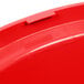 A red plastic dome lid for a Rubbermaid 44 gallon trash can.