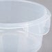 A Rubbermaid translucent round plastic container with a lid.