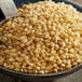 A bowl of Reist white large butterfly popcorn kernels.