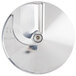 A circular silver metal plate with a smaller circular hole in the center.