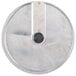 A circular metal object with a black handle.