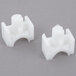 A pair of white plastic pieces.