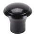 A close-up of a black round knob.