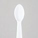 A Solo white plastic taster spoon.