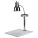 A chrome Hanson Heat Lamp over a white surface.