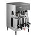 A Bunn BrewWISE dual coffee machine with two coffee pots on top.