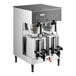 A Bunn commercial coffee machine with two silver coffee pots on top.