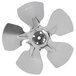 A close-up of a circular metal Avantco condenser fan blade with holes.