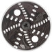 A Waring reversible grating and shredding disc, a circular object with holes in it.