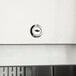 A close-up of an Avantco replacement door lock cylinder keyhole.