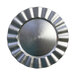 A close-up of a silver plate with a scalloped edge.
