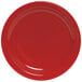 A close-up of a Tuxton Cayenne Colorado china plate with a red background and white line.