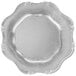 A white background with a silver Charge It by Jay Baroque charger plate with a scalloped edge.