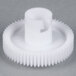 A white plastic Bar Maid gear with a hole.